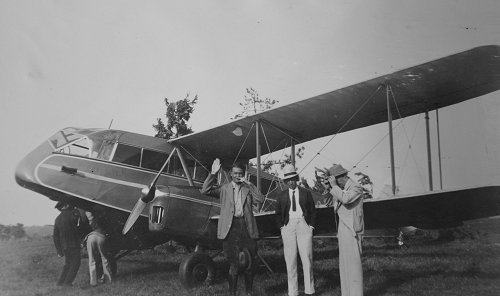 Members of the cast with the aircraft, Paderewski in the centre wearing the white hat. The gentleman to his left is giving a timely impression of the new chancellor of Germany.