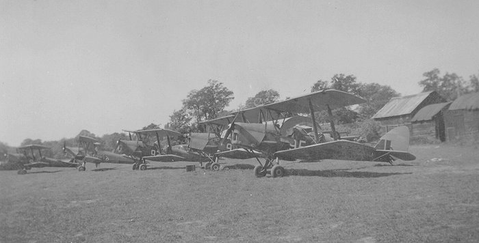 Duing the war, Malcolm Carlisle worked at Denham as an engineer for Airwork who provided support services to 21 EFTS throughout the conflict. He took this image of the Tiger Moths of F flight at Denham in 1941.