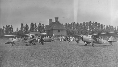 The Piper Cub and Auster Archer trainers of the Denham Aero Club at Denham in 1949. The club building is just out of shot to the right of the Auster.