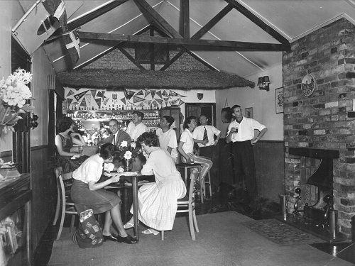 The Denham Flying Club hut boasted a bar and offices, accessed through the door seen at the right hand end of the bar.