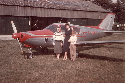 Aerodrome Manager Eva Bickerton with G-ARNV, an Italian Procaer F15B Picchio operated as a charter aircraft by Parker and Head.