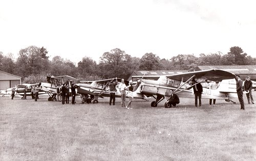 Some of the aircraft gathered for the resident's party in June. The Lapwing Flying Group's Beagle Terrier, G-ASAD, is nearest the camera.