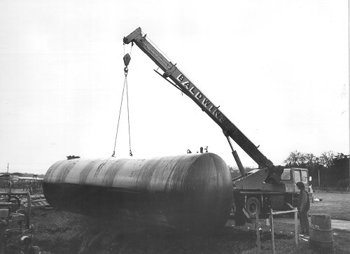 Lowering the tank into position required great care.