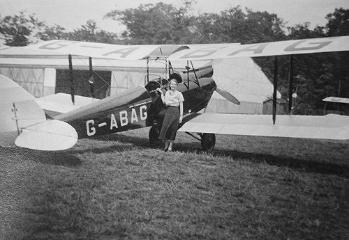 G-ABAG, the dH60 Moth that Myles bought after learning to fly at Hanworth. Standing in front is Margaret Alsager Hawdon, who Myles married in 1926.